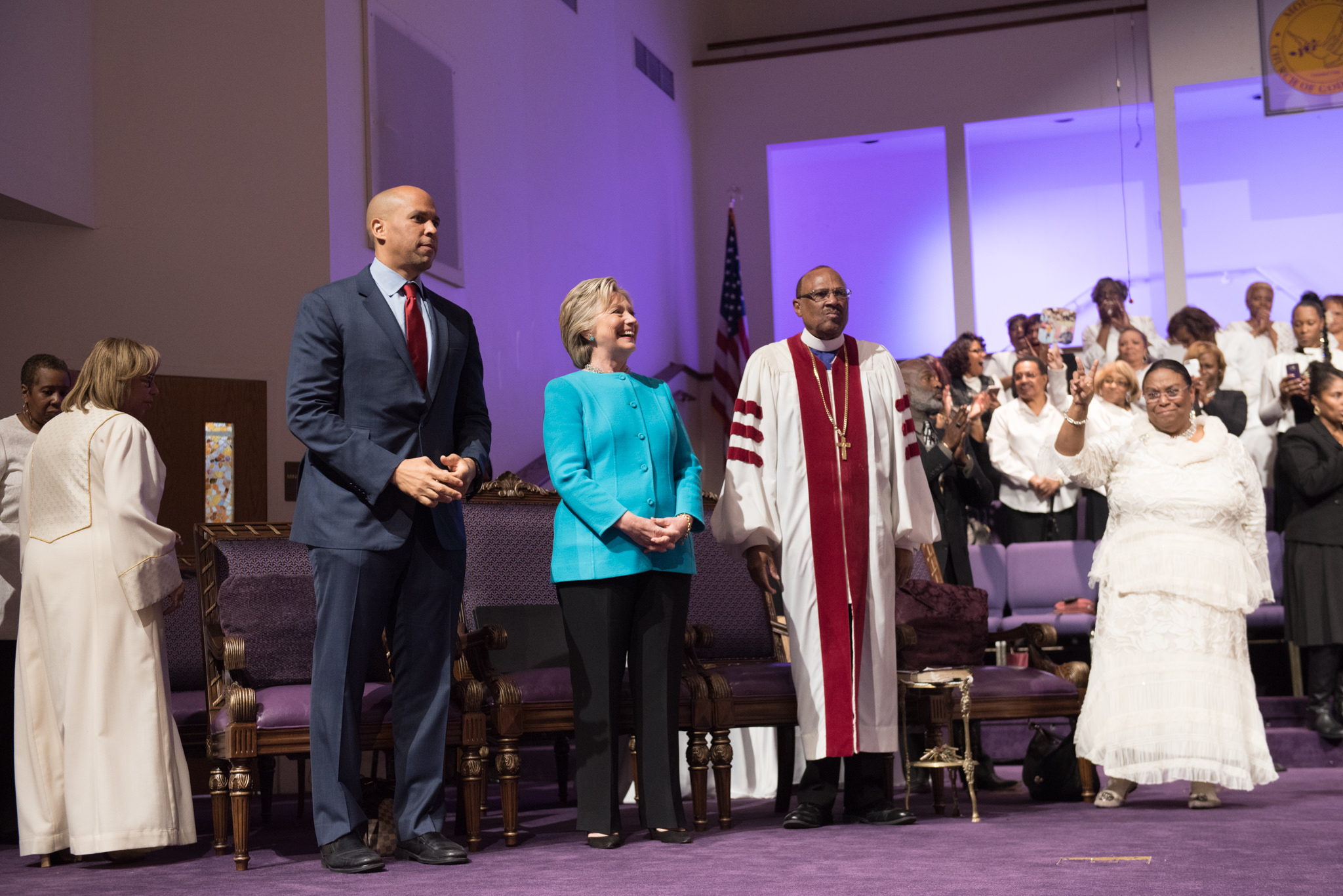 Image of Hillary Clinton and C. Booker in church
