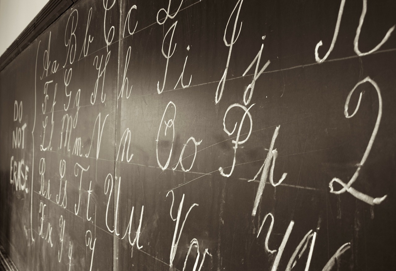 image of black chalkboard with cursive writing