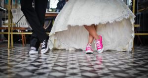 image of tennis shoes in wedding dress and tux