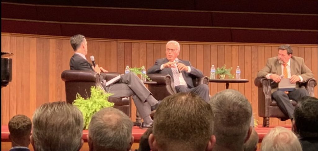 image of john macarthur on stage in chairs