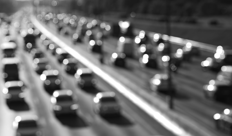Black and white highway car traffic bokeh background