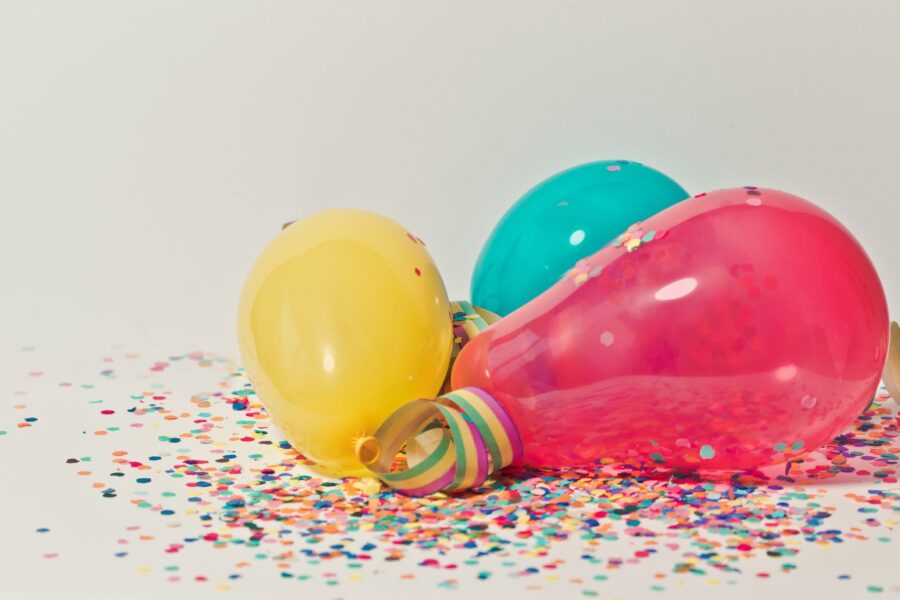 yellow pink and blue party balloons